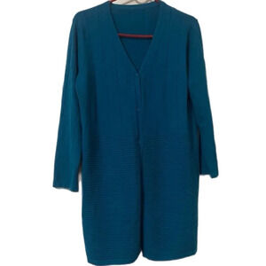 A beautiful aqua blue sweater in the size large